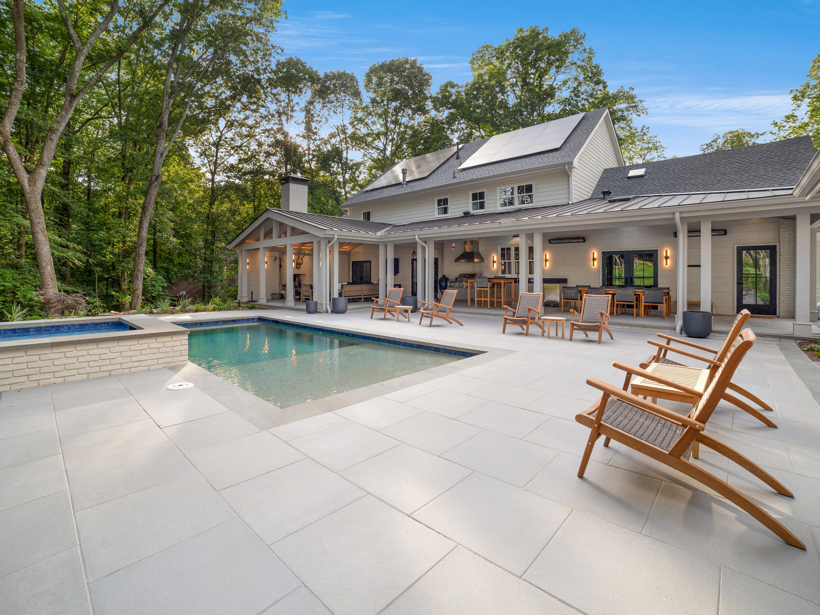 Exterior renovation with pool terrace and outdoor living space